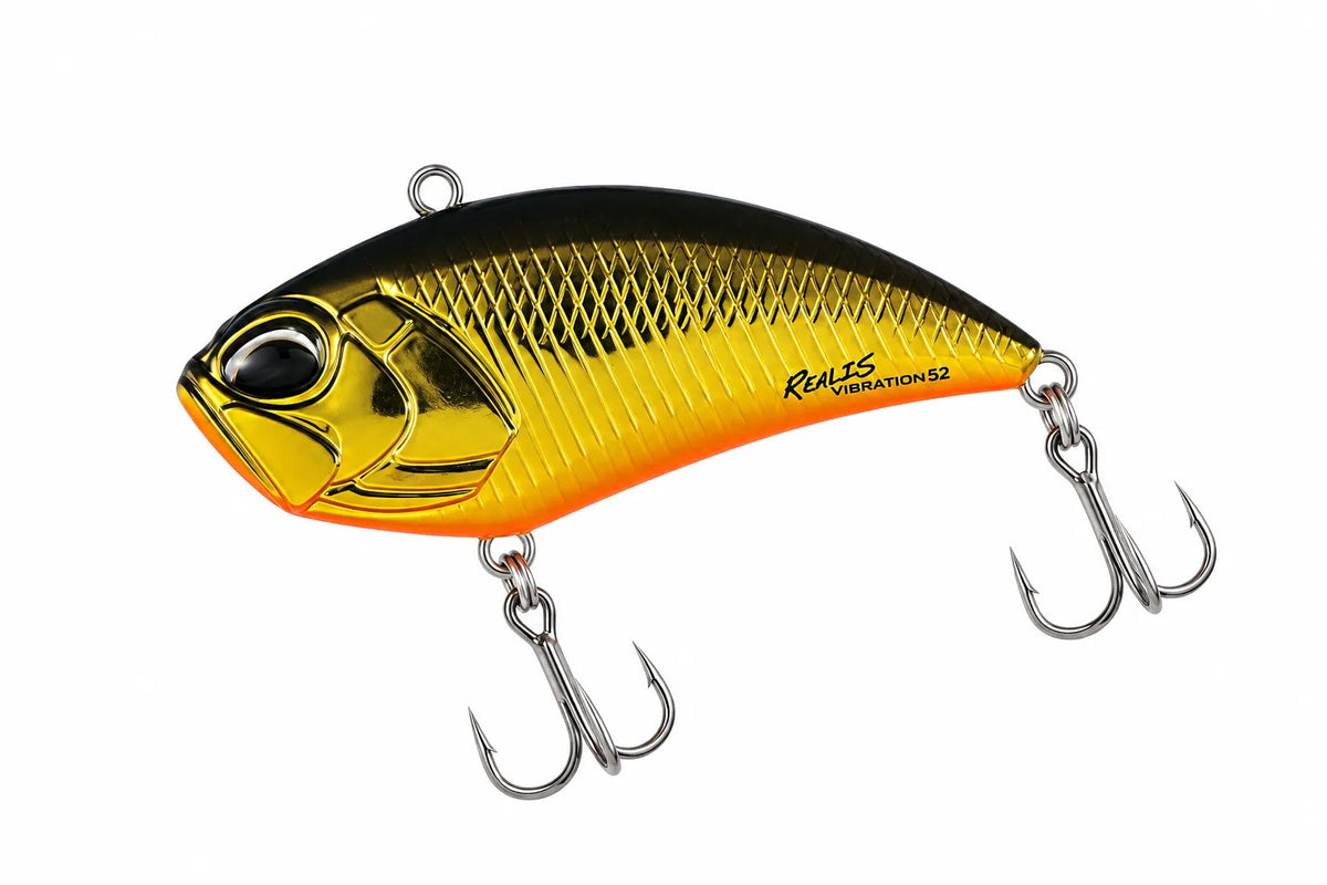 Yellow lipless hard fishing lure with treble hooks on a plain background.