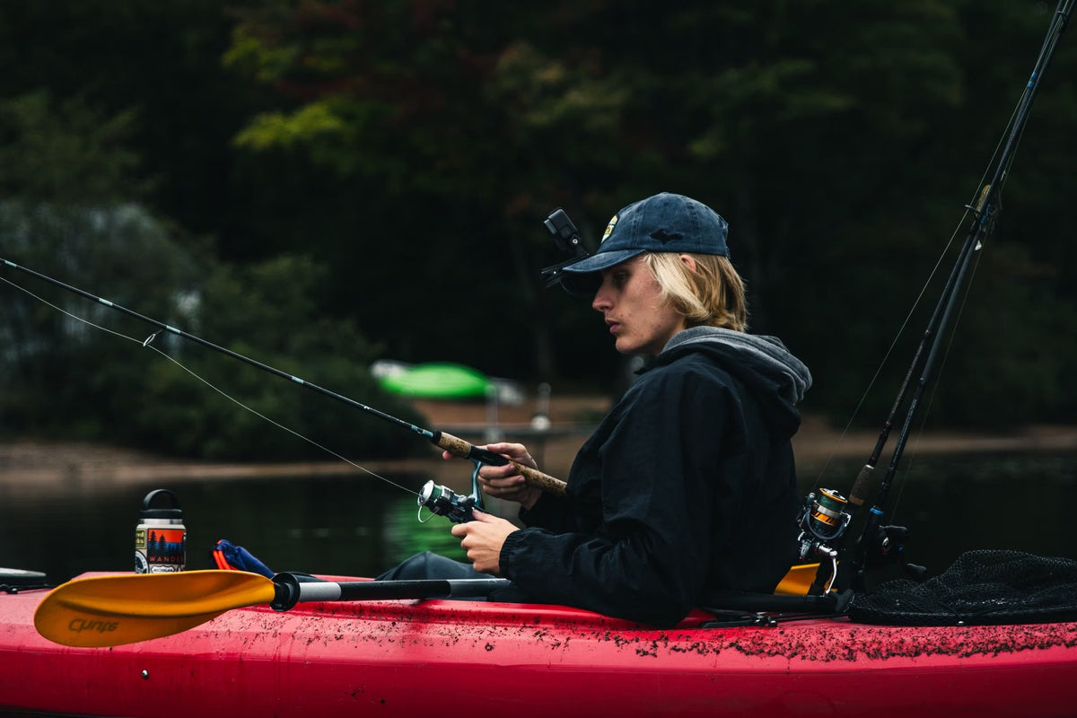 Angler fishing from a kayak on a lake