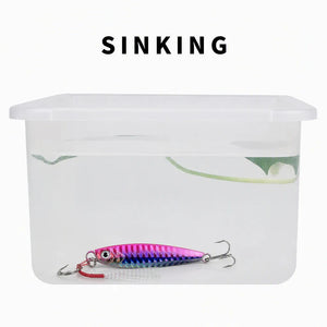 Water test showing a sinking metal jig in a clear container.