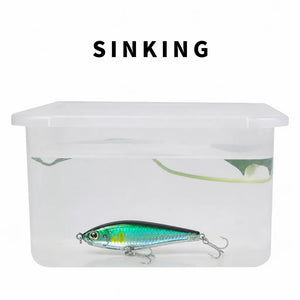 Water test showing a sinking pencil lure in a clear container.